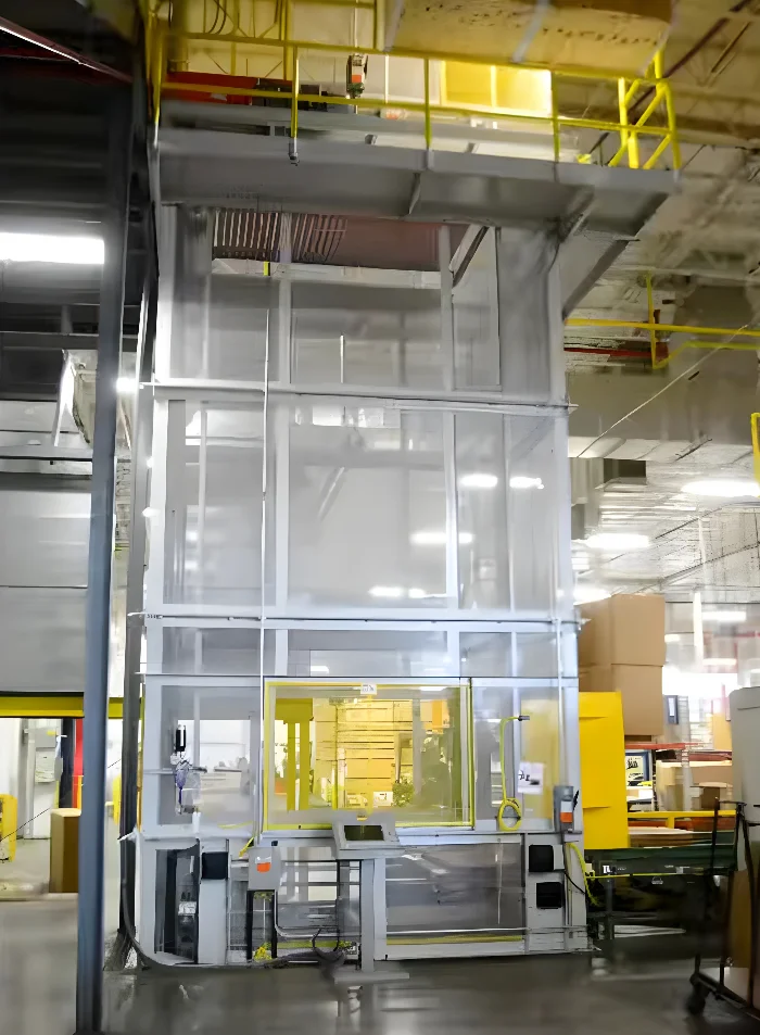 Continuous Vertical Lift System for Multi-Level Warehouse Carton Handling